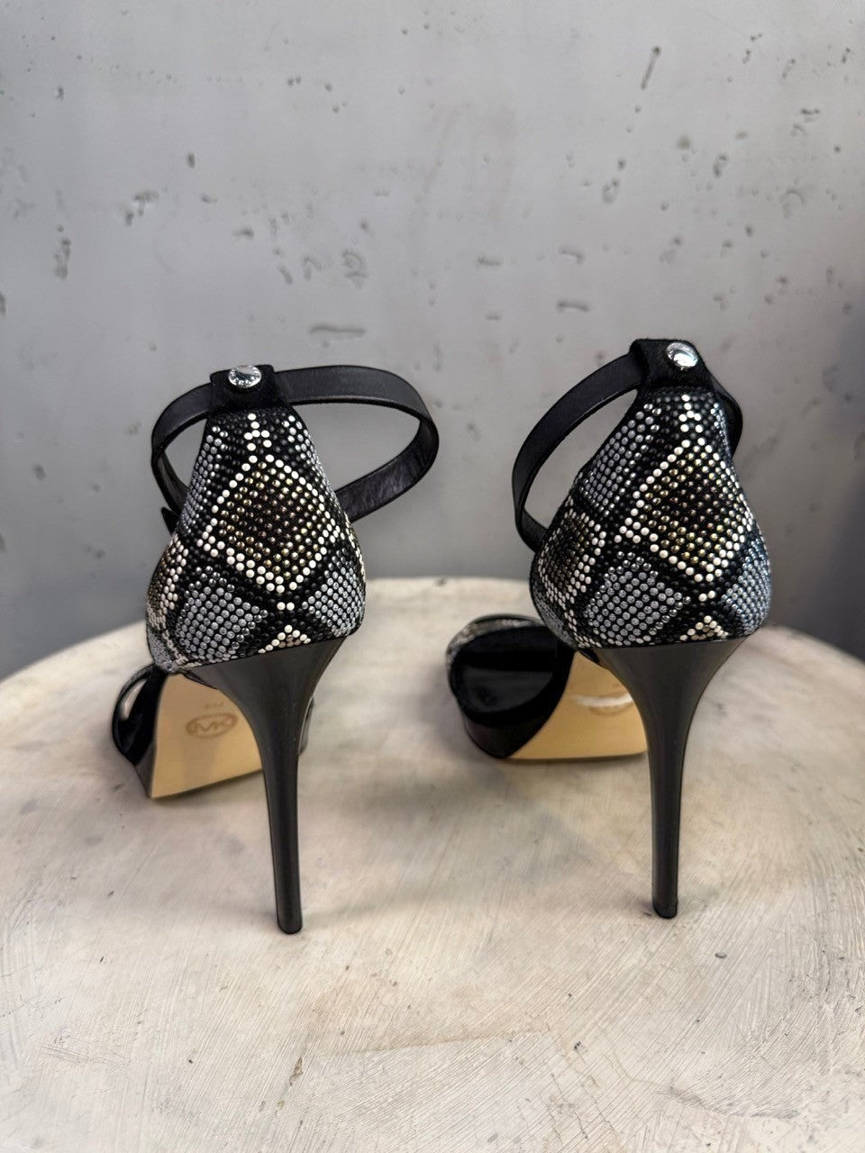 BERLIN VINTAGE CORNER black suede stiletto heels with rhinestone snake-print ankle strap and open toe.