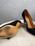 BERLIN VINTAGE CORNER black suede stiletto pumps with pointed toe and bow detail on a white surface