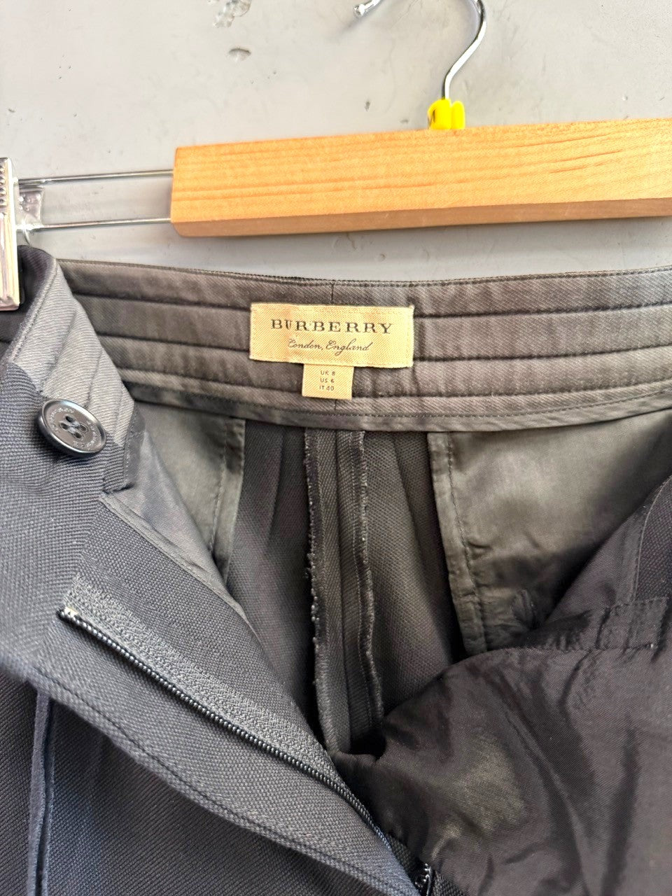BERLIN VINTAGE CORNER black tailored dress pants with satin side detail and button closure.