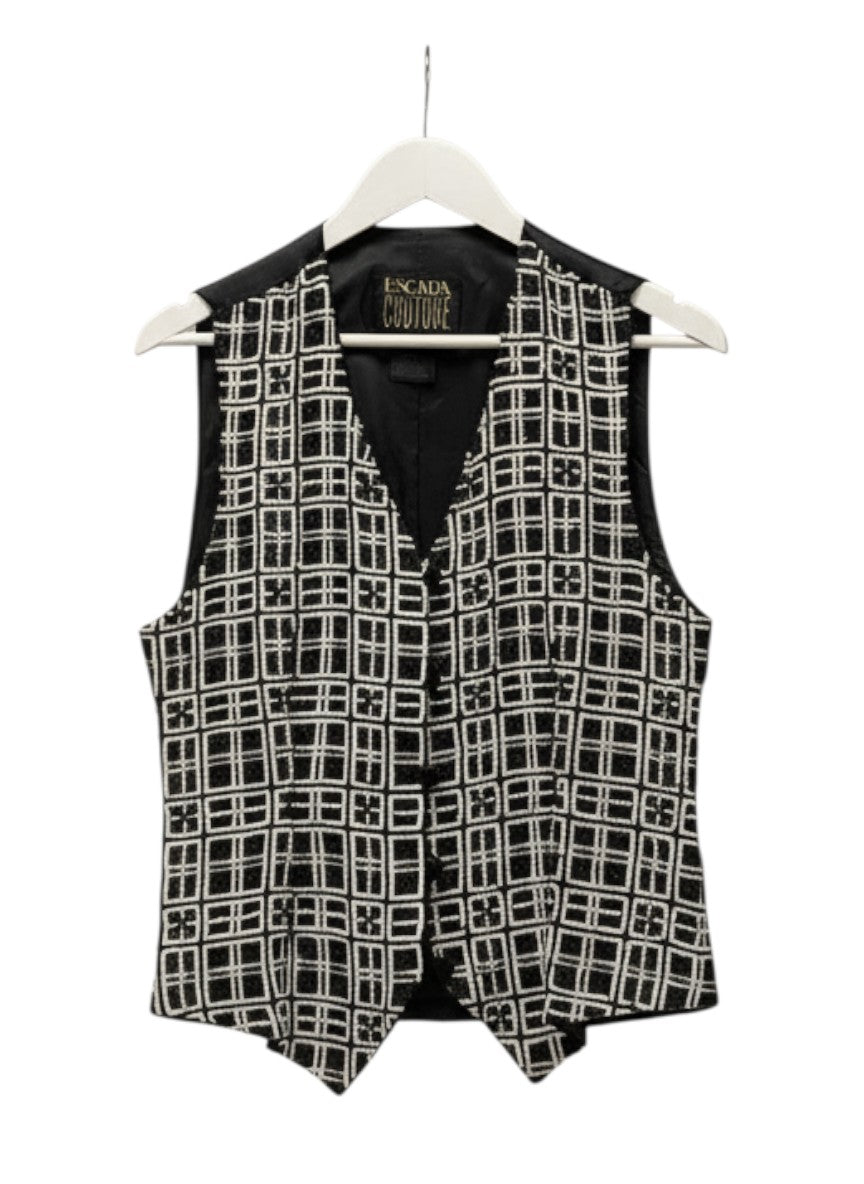 BERLIN VINTAGE CORNER black and white geometric beaded vest. Sleeveless V-neck vest with button front closure.