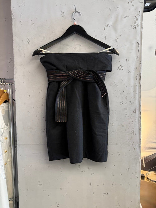 BERLIN VINTAGE CORNER black wool blend wide leg trousers with rose gold stitching detail on wrap belt.