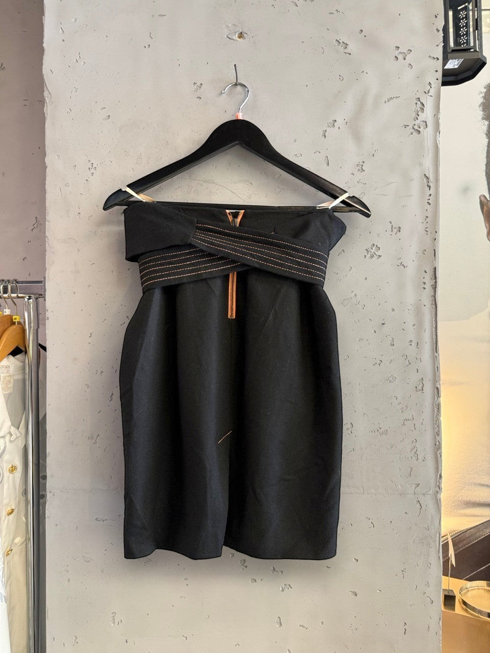 BERLIN VINTAGE CORNER black wool blend wide leg trousers with rose gold stitching and wrap belt detail.