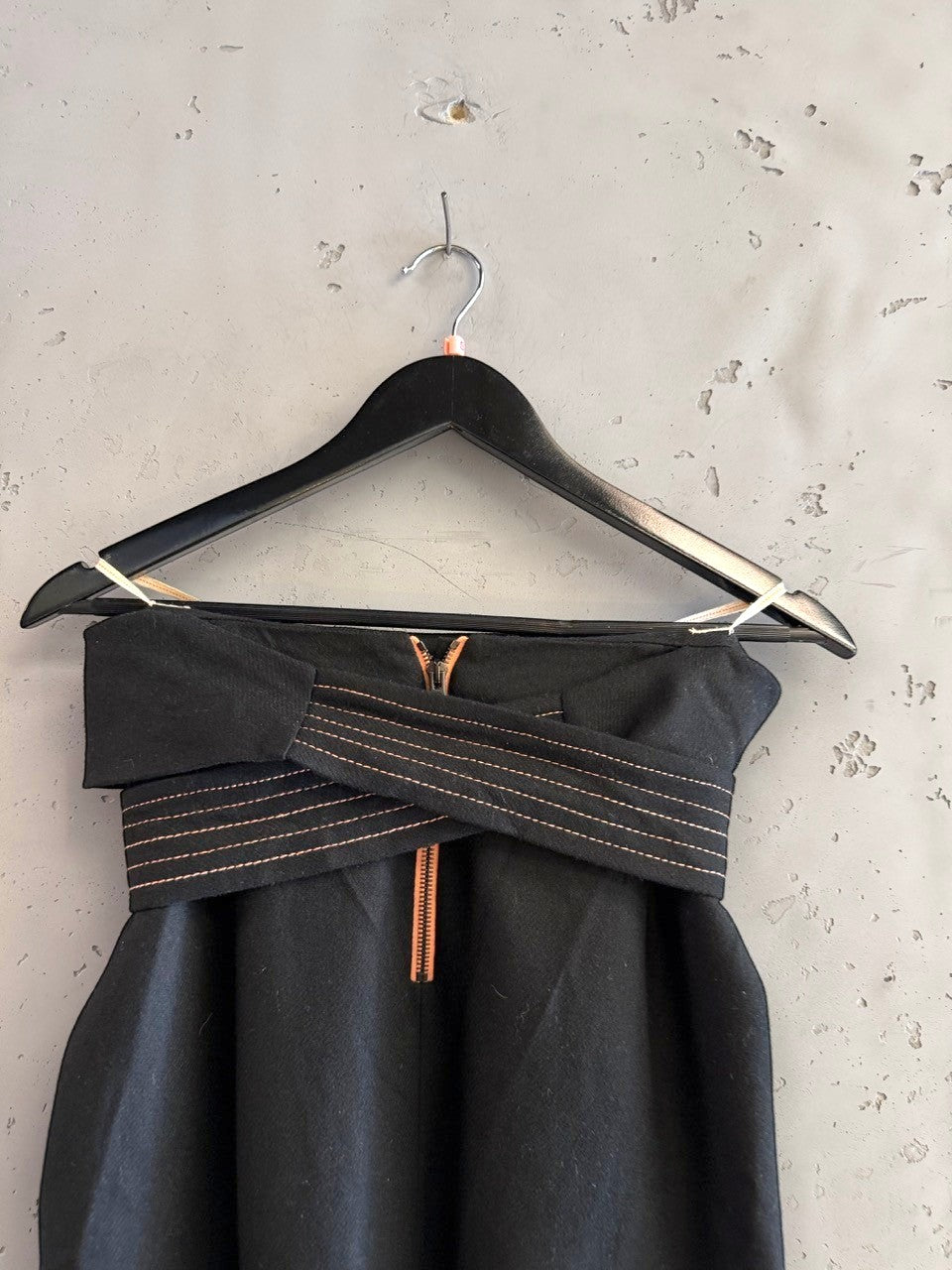BERLIN VINTAGE CORNER black wool blend wide leg trousers with rose gold stitching and zip detail.