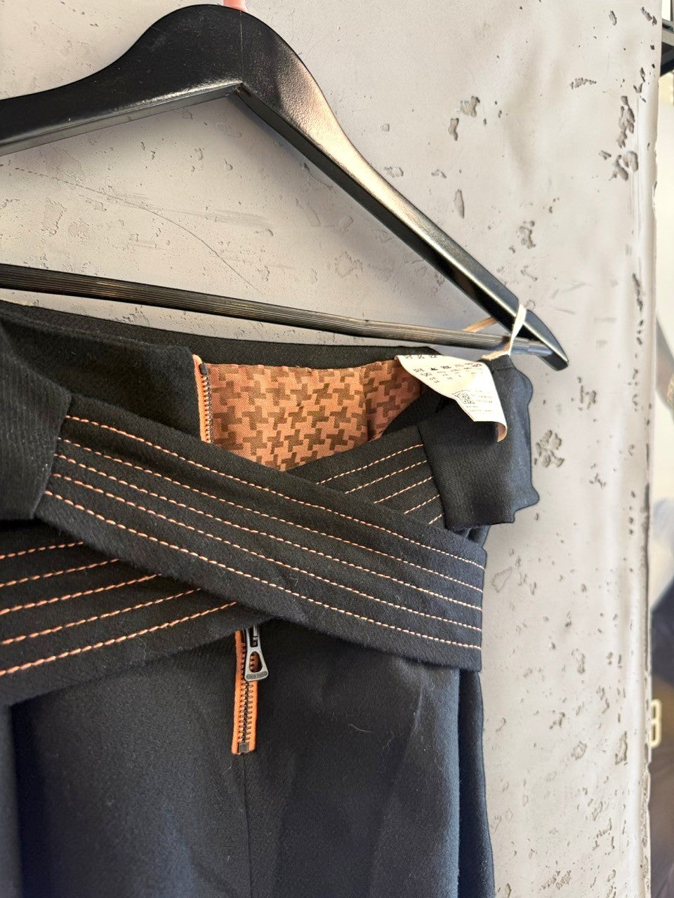 BERLIN VINTAGE CORNER black wool blend wide leg trousers with rose gold stitching and houndstooth lining.
