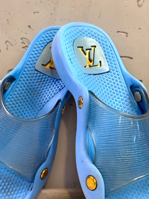 BERLIN VINTAGE CORNER blue Louis Vuitton slides with translucent straps and gold-tone hardware.