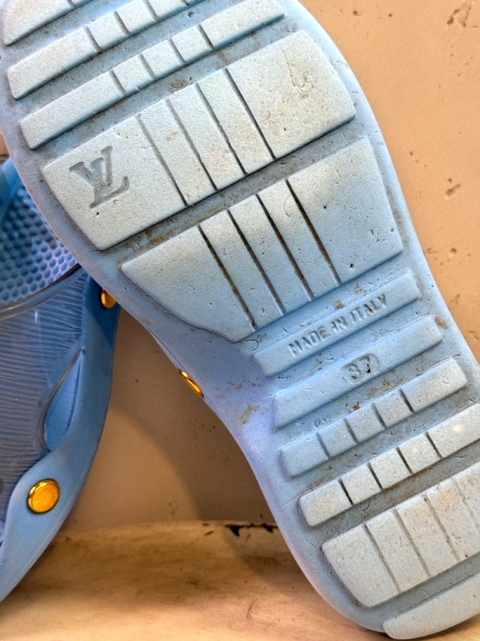 BERLIN VINTAGE CORNER light blue slides with gold-tone hardware and Louis Vuitton logo on sole. Made in Italy.