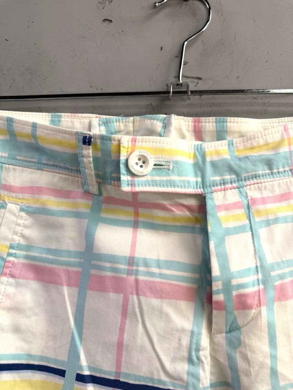 BERLIN VINTAGE CORNER Bogner plaid cotton shorts in pastel pink, yellow, and blue with a white button closure.