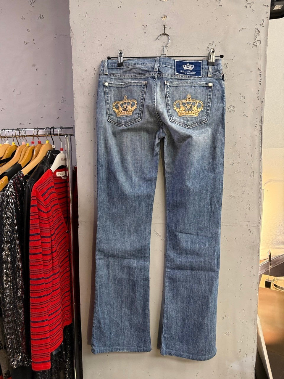 BERLIN VINTAGE CORNER mid-wash denim bootcut jeans with gold crown embroidery on back pockets.