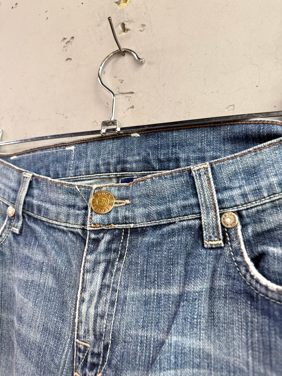 BERLIN VINTAGE CORNER mid-wash denim bootcut jeans with whiskering and faded details.