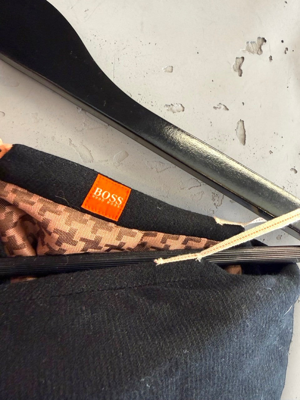 BERLIN VINTAGE CORNER BOSS black wool blend wide leg trousers with houndstooth lining and rose gold stitching detail.