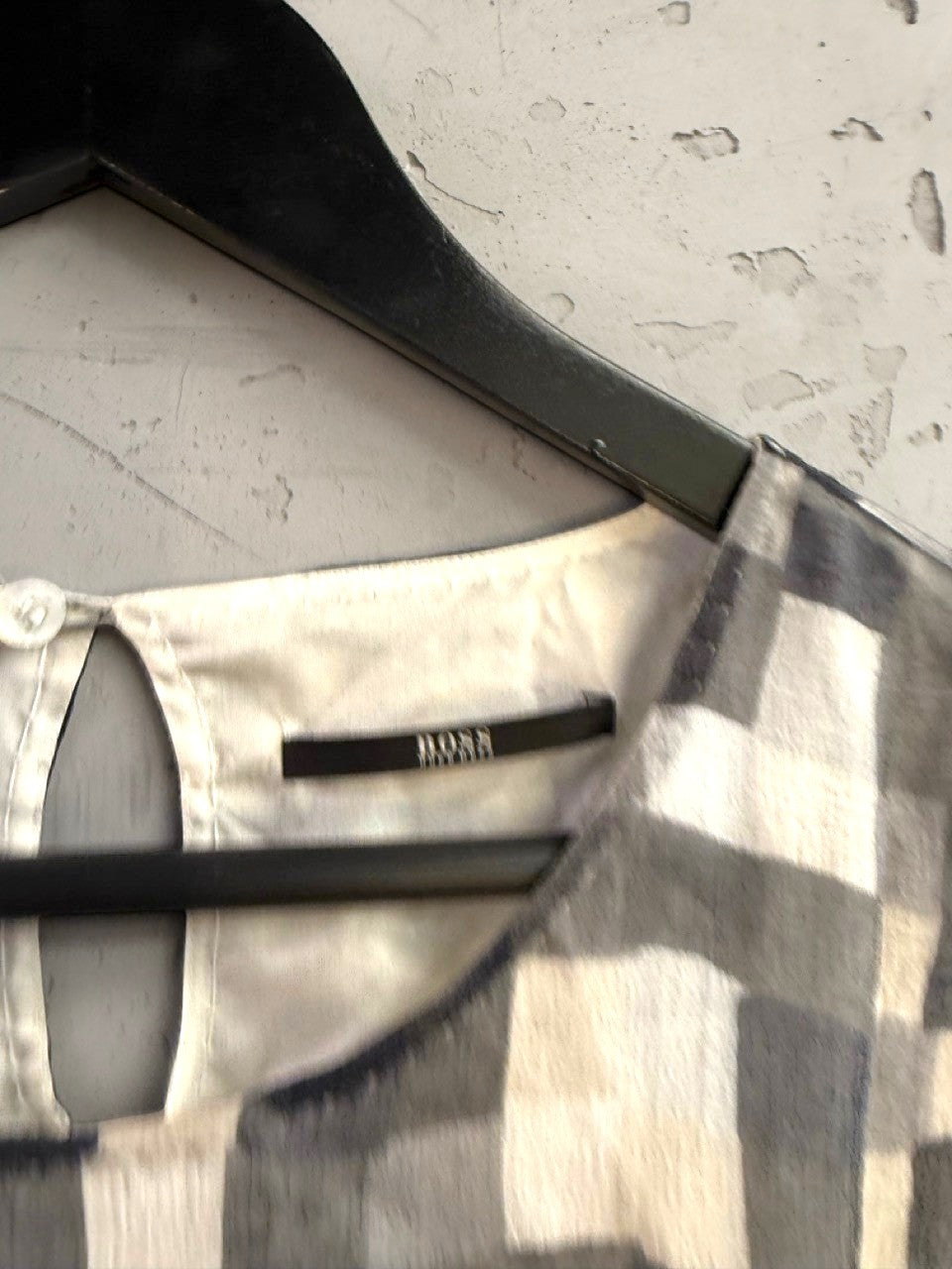 BERLIN VINTAGE CORNER BOSS sleeveless midi dress with monochrome abstract checkerboard print and back button closure.