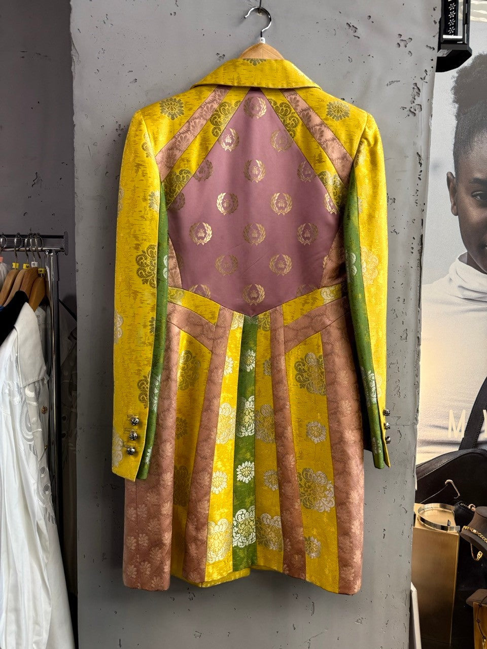 BERLIN VINTAGE CORNER yellow brocade jacket with gold floral motifs, dusty rose panels with bee emblem, and emerald green accents.