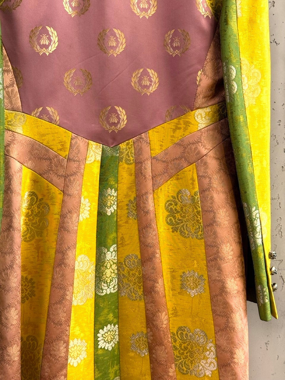 BERLIN VINTAGE CORNER multi-paneled brocade jacket in yellow, dusty rose, and emerald green with gold bee and floral motifs.