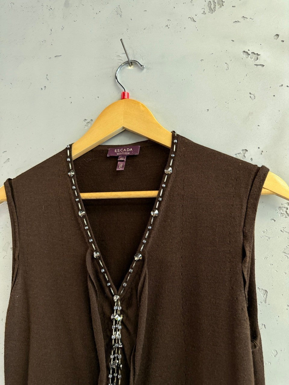 BERLIN VINTAGE CORNER sleeveless knit vest in chocolate brown with beaded V-neckline and cascading embellishment.