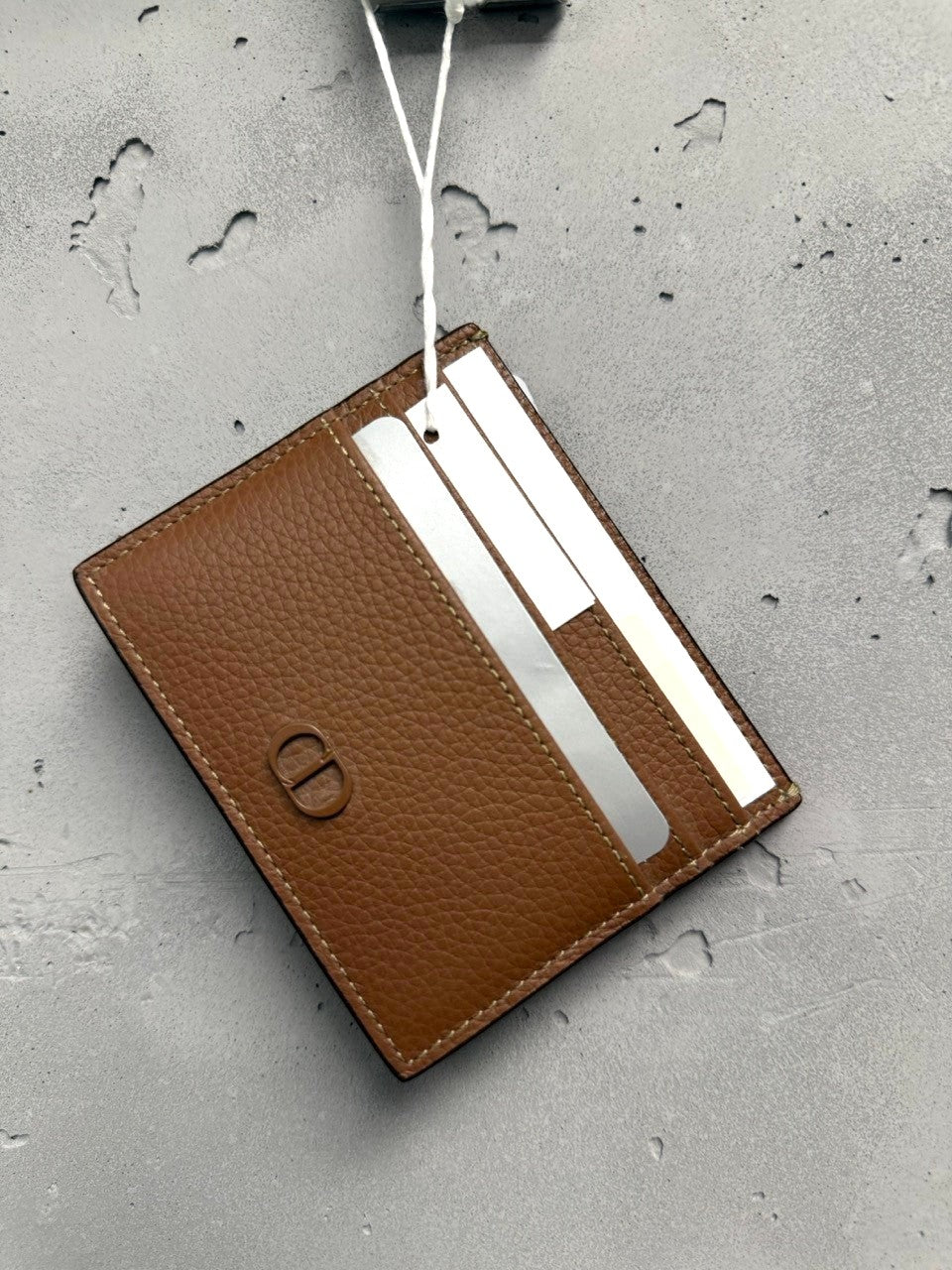 BERLIN VINTAGE CORNER brown textured leather cardholder with multiple slots and subtle CD logo.