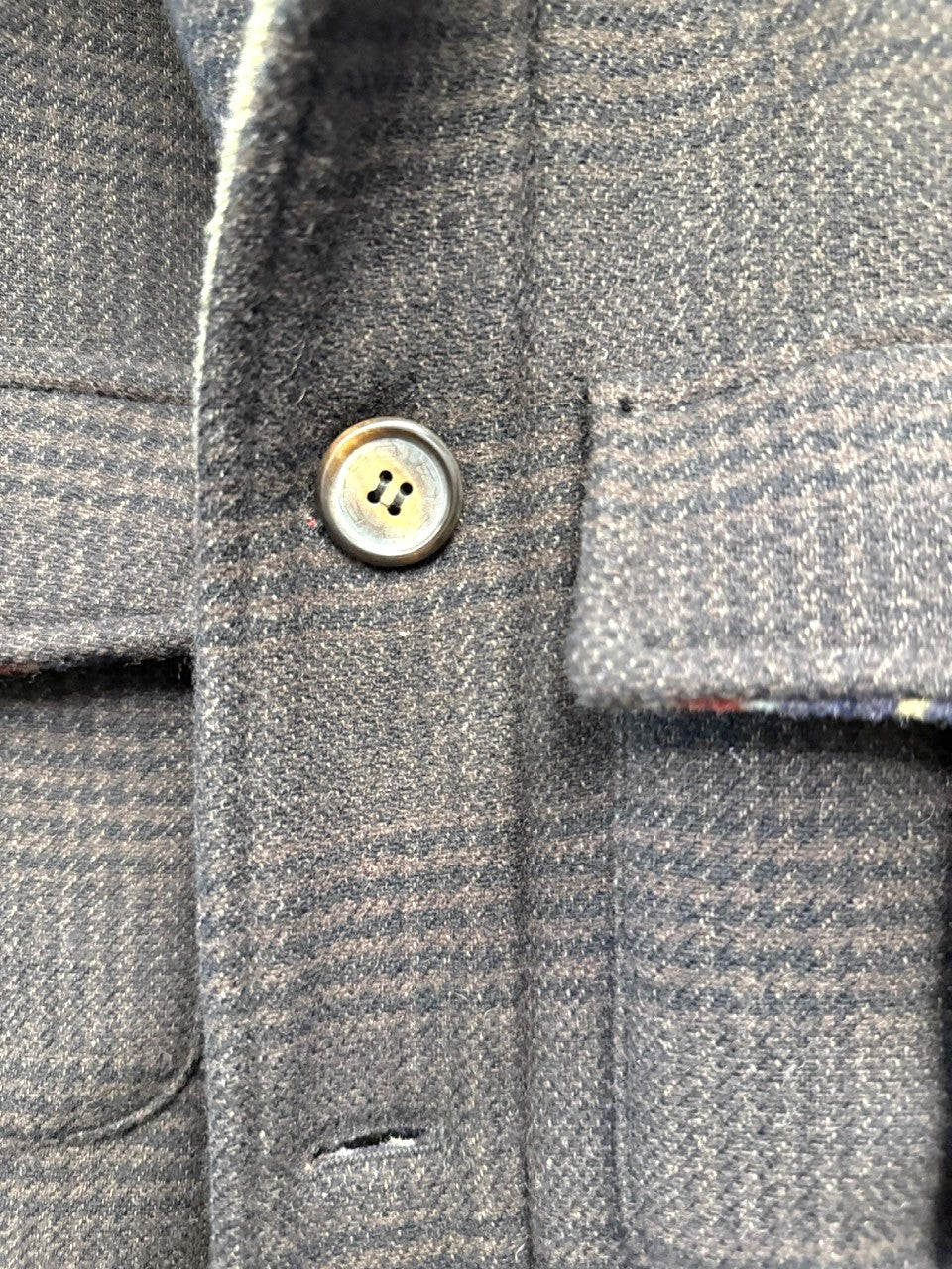 BERLIN VINTAGE CORNER brown plaid wool blend field jacket with striped lining and flap pockets.