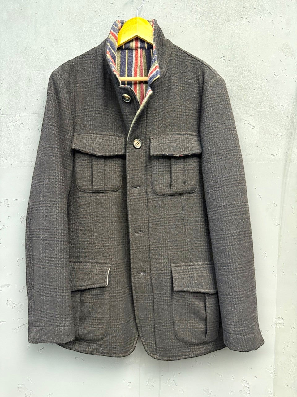 BERLIN VINTAGE CORNER brown plaid wool blend field jacket with striped lining and four flap pockets.