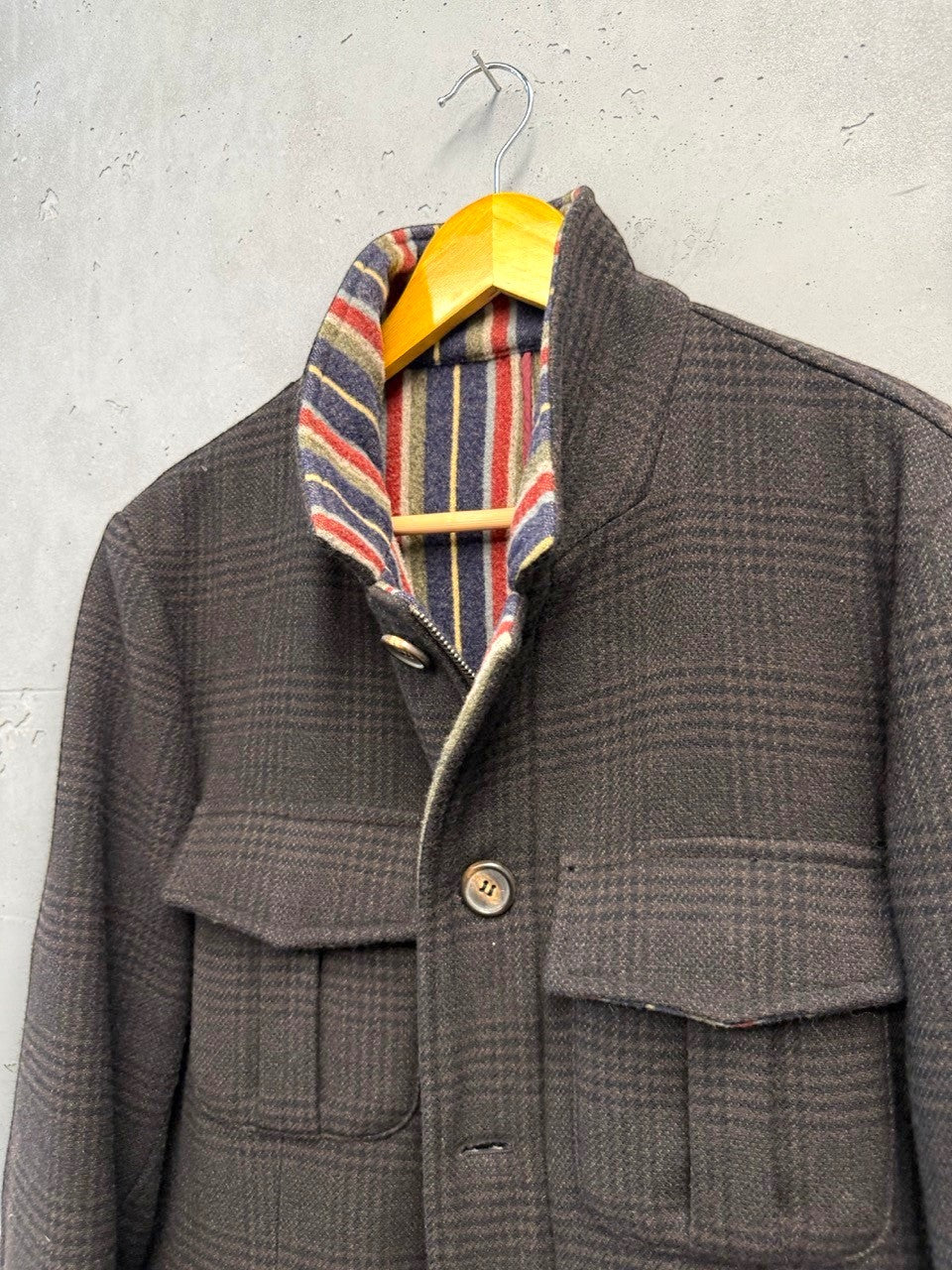 BERLIN VINTAGE CORNER brown plaid wool blend field jacket with striped lining and flap pockets.