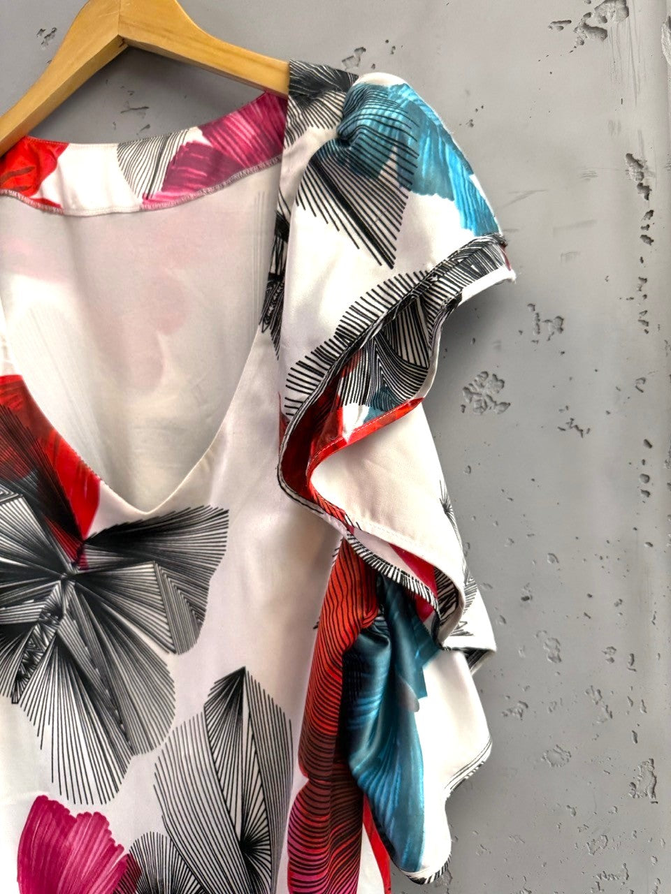BERLIN VINTAGE CORNER white silk blend dress with butterfly print, ruffled sleeves, red, blue, and black details.