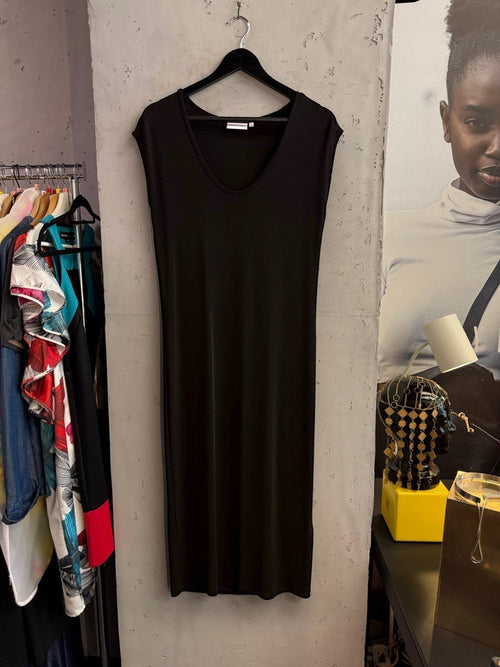 BERLIN VINTAGE CORNER black Calvin Klein sleeveless midi dress with a V-neckline hanging on a black hanger.
