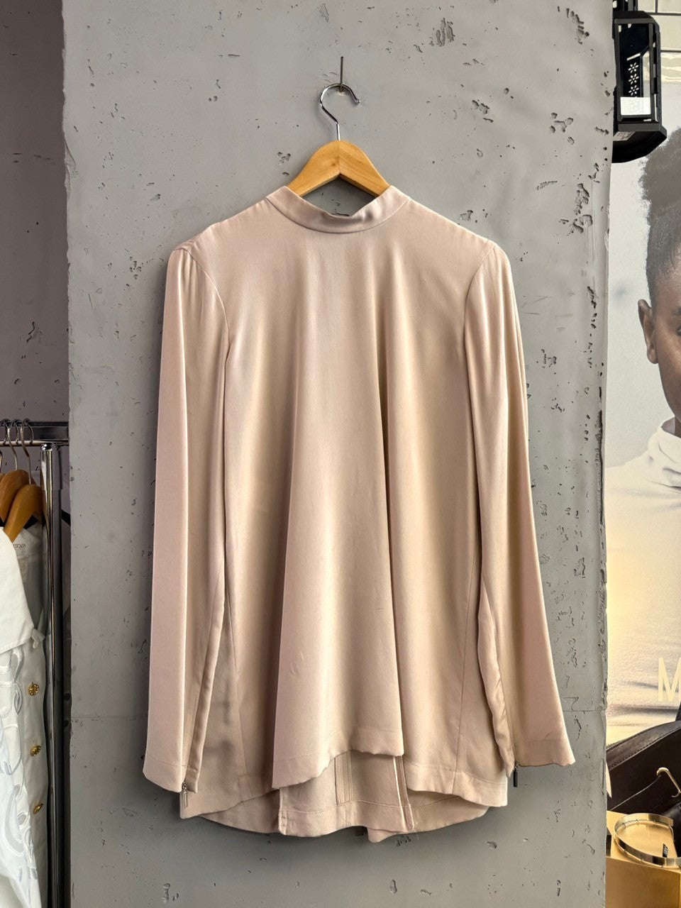 BERLIN VINTAGE CORNER champagne long sleeve mock neck blouse with front zipper and back pleat detail.
