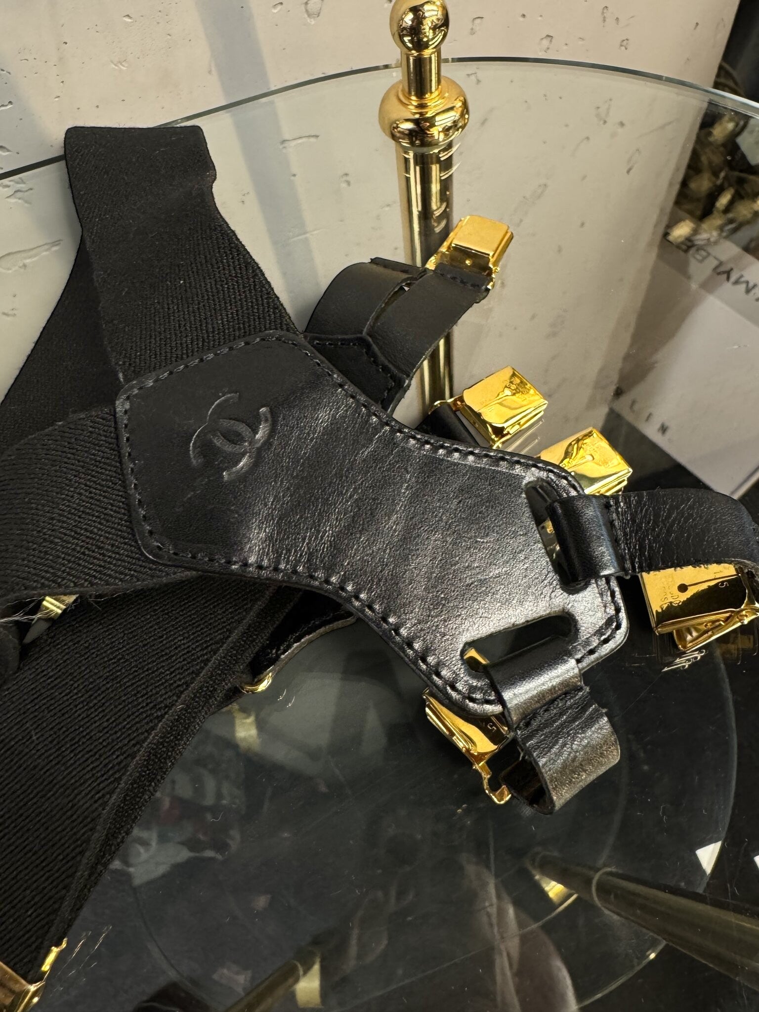 BERLIN VINTAGE CORNER black elastic CHANEL suspenders featuring premium leather detailing and gold-toned hardware