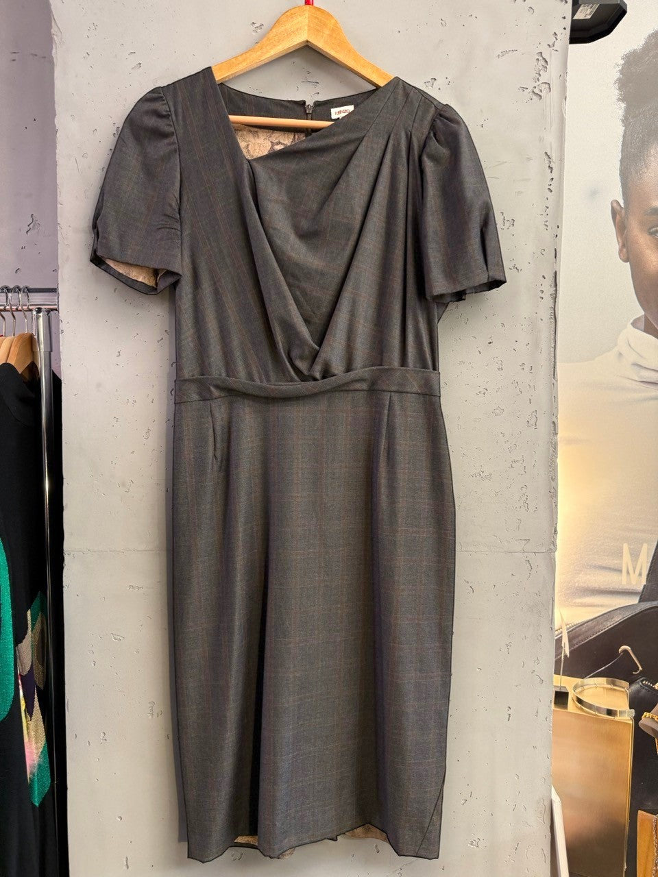 BERLIN VINTAGE CORNER charcoal grey pinstripe midi dress with V-neck, draped bodice, puffed sleeves, and fitted waist.