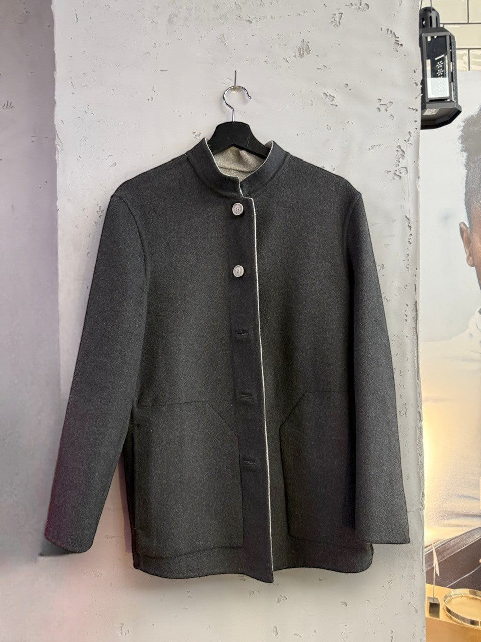 BERLIN VINTAGE CORNER charcoal grey wool blend jacket with band collar, button front, and two pockets. Light grey trim detail.