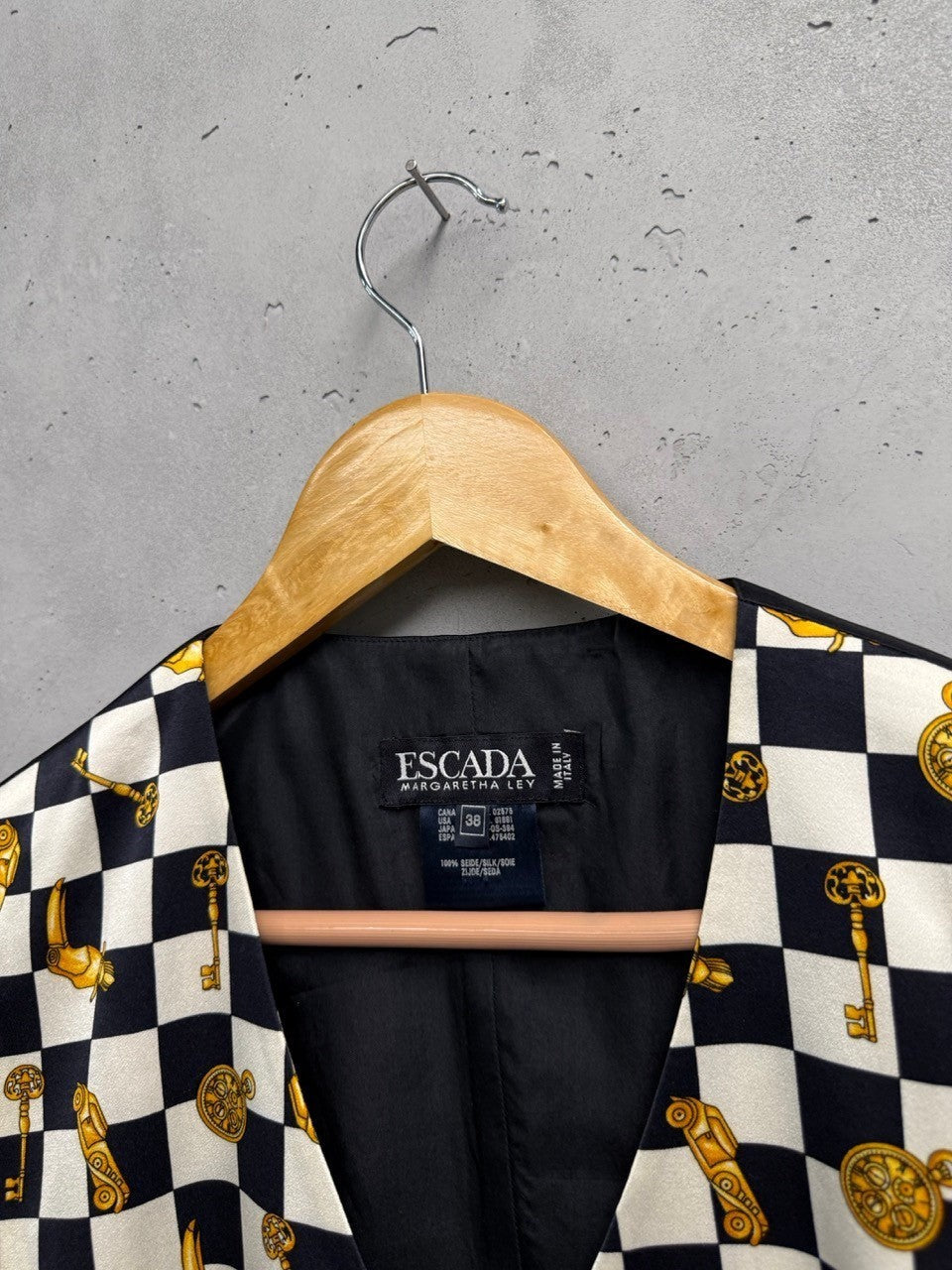 BERLIN VINTAGE CORNER black and white checkerboard vest with gold key and clock print. Sleeveless V-neck vest.