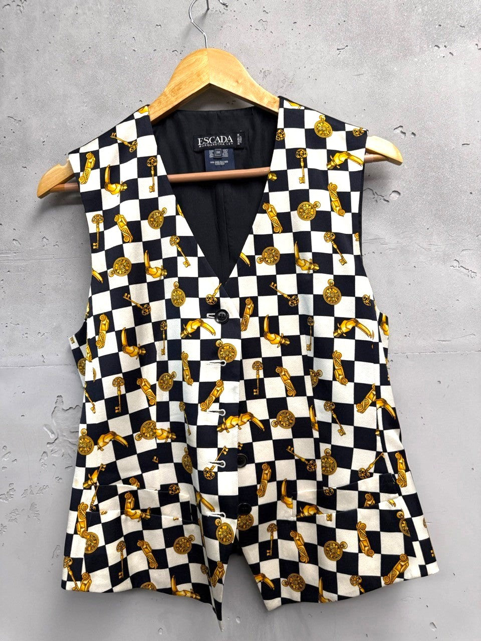 BERLIN VINTAGE CORNER black and white checkerboard vest with gold key and clock print. Sleeveless V-neck vest with button front.