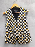 BERLIN VINTAGE CORNER black and white checkerboard vest with gold key and clock print. Sleeveless V-neck vest with button front.
