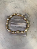 Christian Dior gold-tone necklace with alternating pearls and crystals. Features unique pearl shapes and sparkling clear crystals.