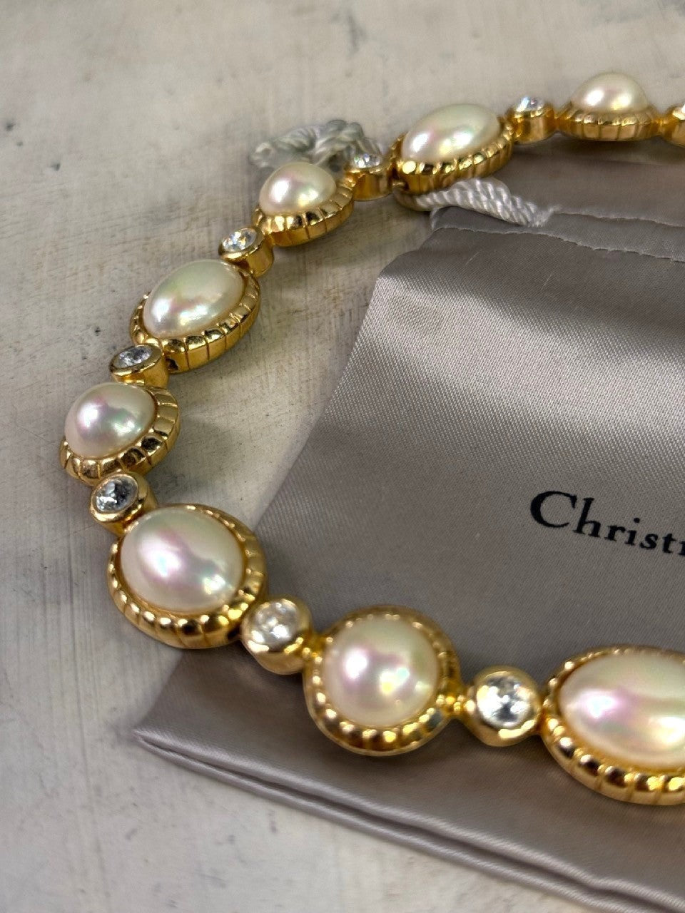 BERLIN VINTAGE CORNER Christian Dior gold-tone necklace with pearls and crystals. Features unique pearls and sparkling clear crystals.
