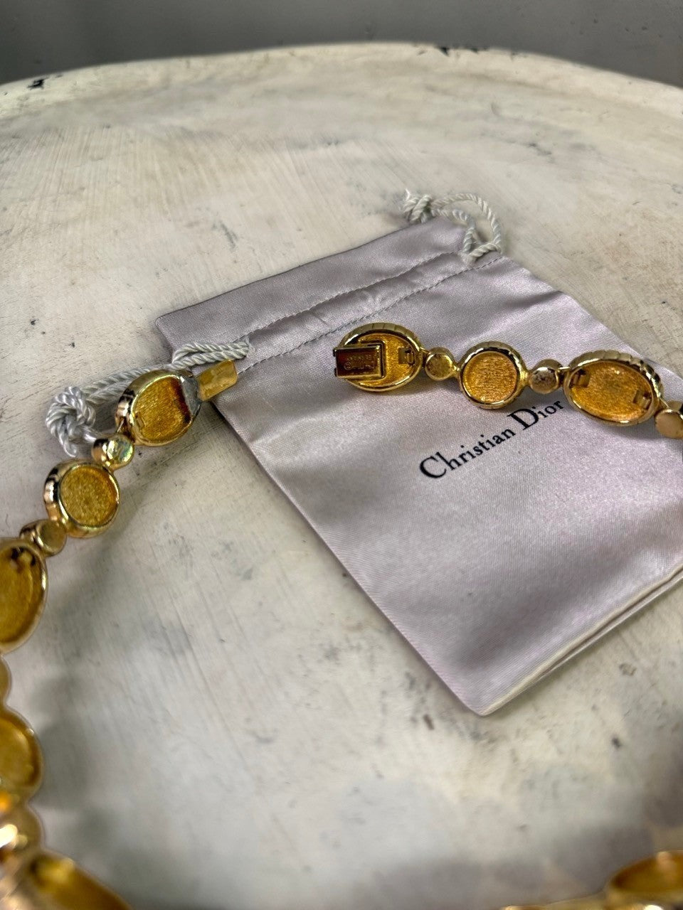 Christian Dior gold-tone necklace with pearls and crystals, featuring an alternating pattern and original pouch.