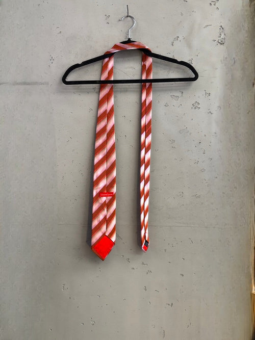 BERLIN VINTAGE CORNER Christian Lacroix pink and burnt orange striped silk necktie with diagonal pattern.
