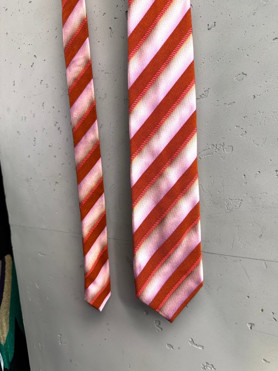 BERLIN VINTAGE CORNER Christian Lacroix silk necktie with diagonal pink and burnt orange stripes.