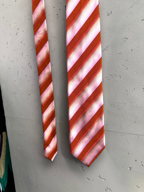 BERLIN VINTAGE CORNER Christian Lacroix silk necktie with diagonal pink and burnt orange stripes.