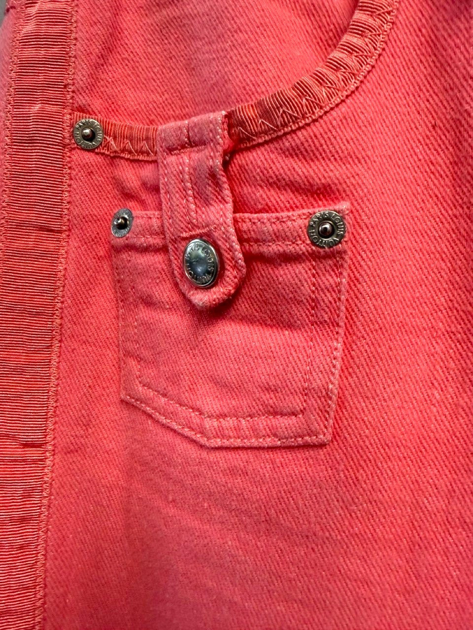 BERLIN VINTAGE CORNER coral pink denim cropped pants with textured side seams and signature hardware.