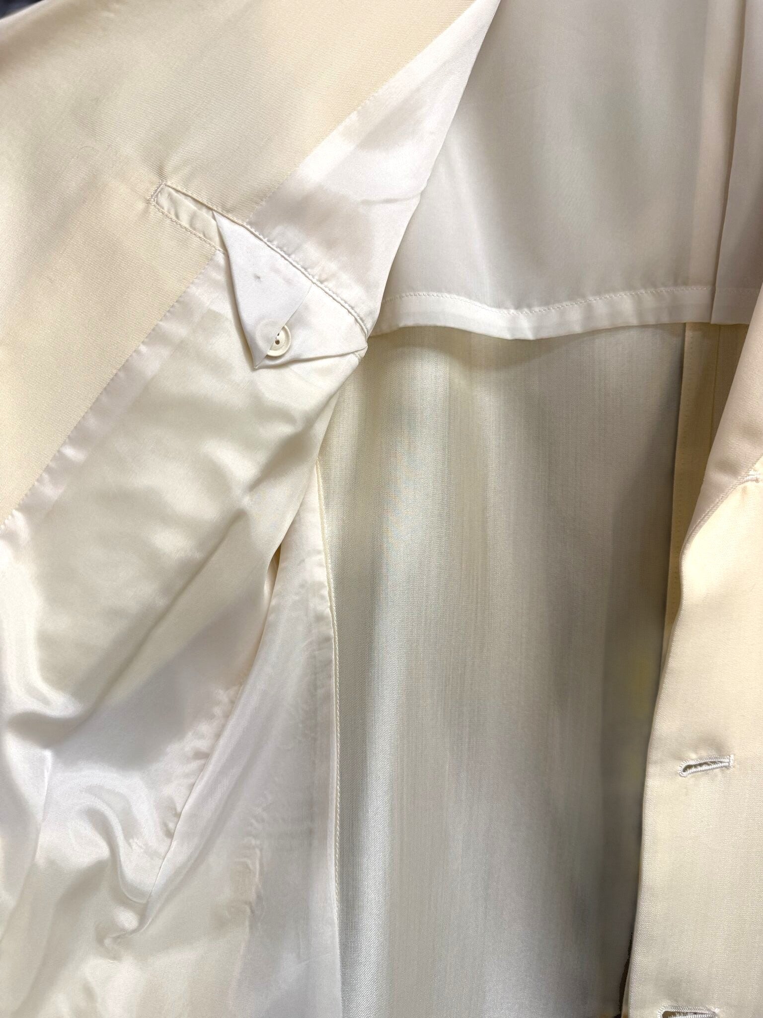 Interior view of a BERLIN VINTAGE CORNER cream Yohji Yamamoto blazer showing the smooth lining and internal pocket.