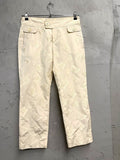 BERLIN VINTAGE CORNER cream trousers with all-over embroidered butterflies and button-fly closure.