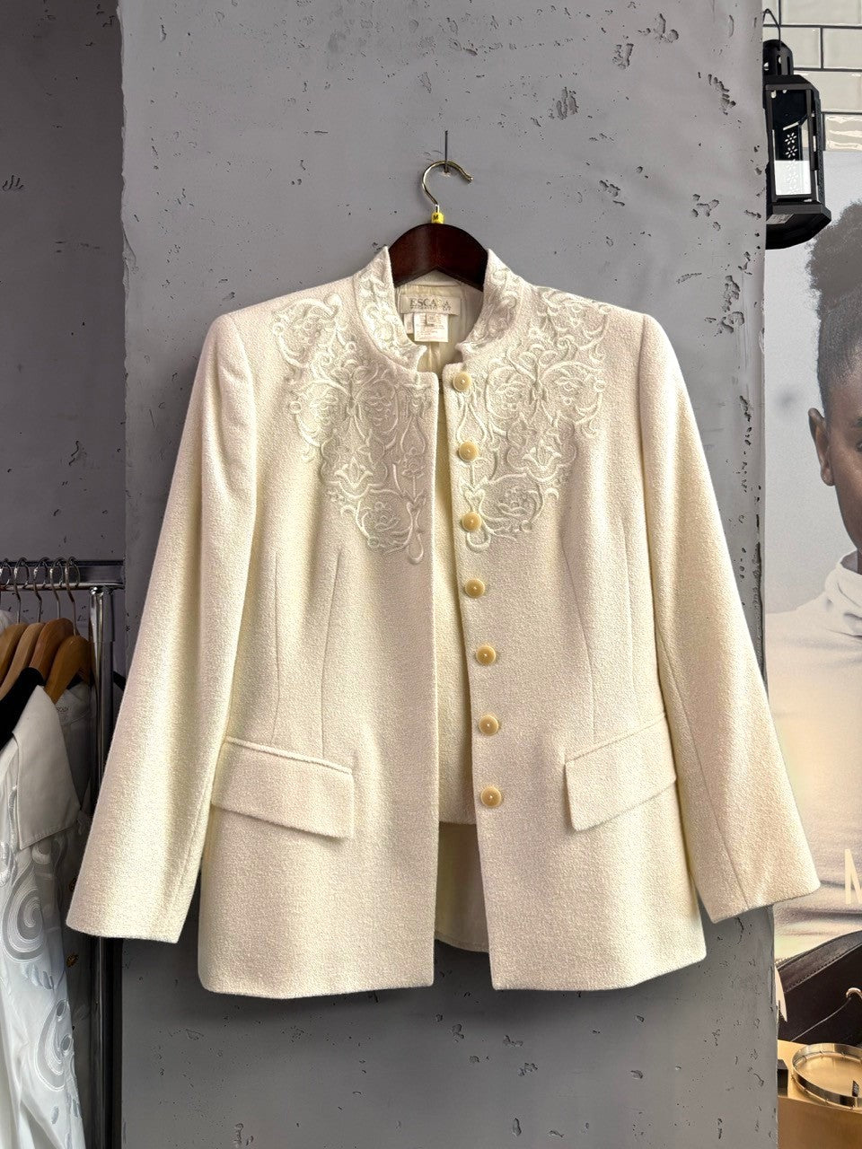 BERLIN VINTAGE CORNER cream wool silk blend jacket and skirt set with tonal embroidery and button closure.
