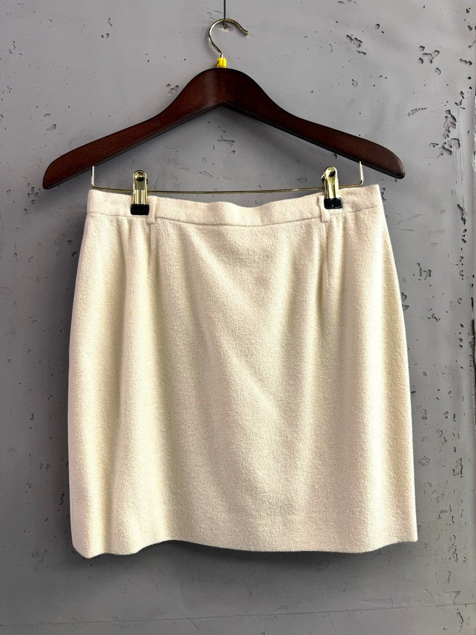 BERLIN VINTAGE CORNER cream wool silk blend skirt with tonal embroidery, round neckline, and button closure.