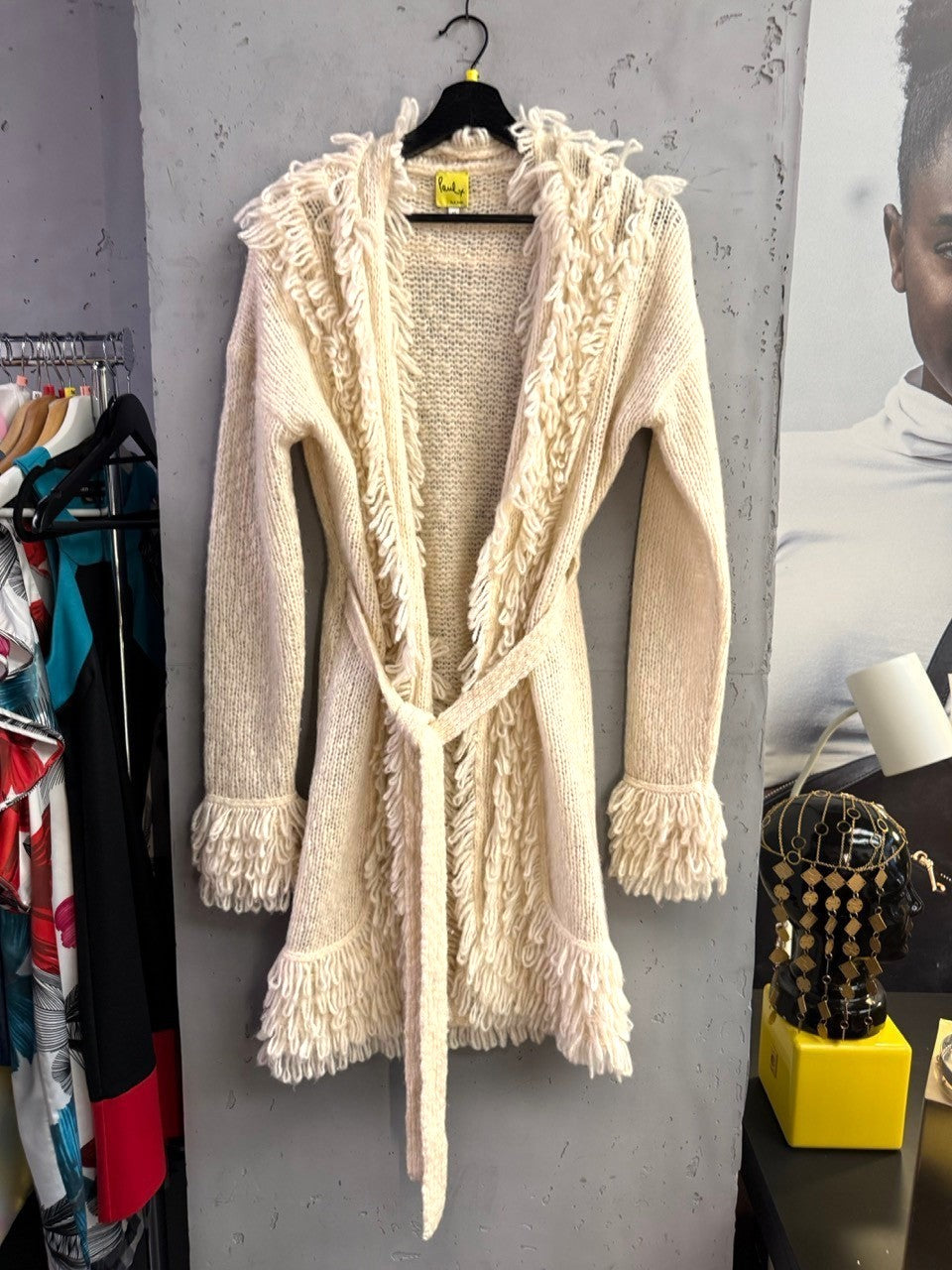 BERLIN VINTAGE CORNER cream Paul Smith long knit cardigan with fringe trim, open front, and tie-waist belt.