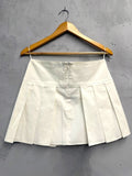 BERLIN VINTAGE CORNER cream pleated mini skirt with high waist and concealed back zipper, made from cotton blend.