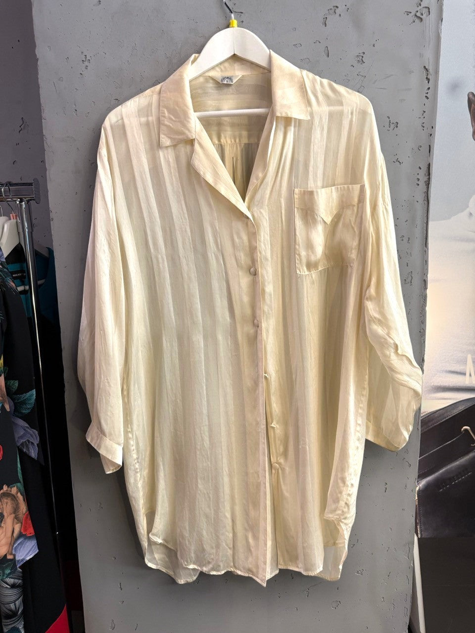 BERLIN VINTAGE CORNER cream oversized button-down shirt with tonal stripes and a chest pocket on a hanger.