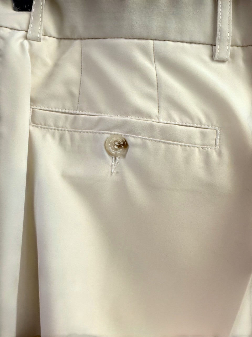 BERLIN VINTAGE CORNER cream tailored trousers with a buttoned back pocket and belt loops.