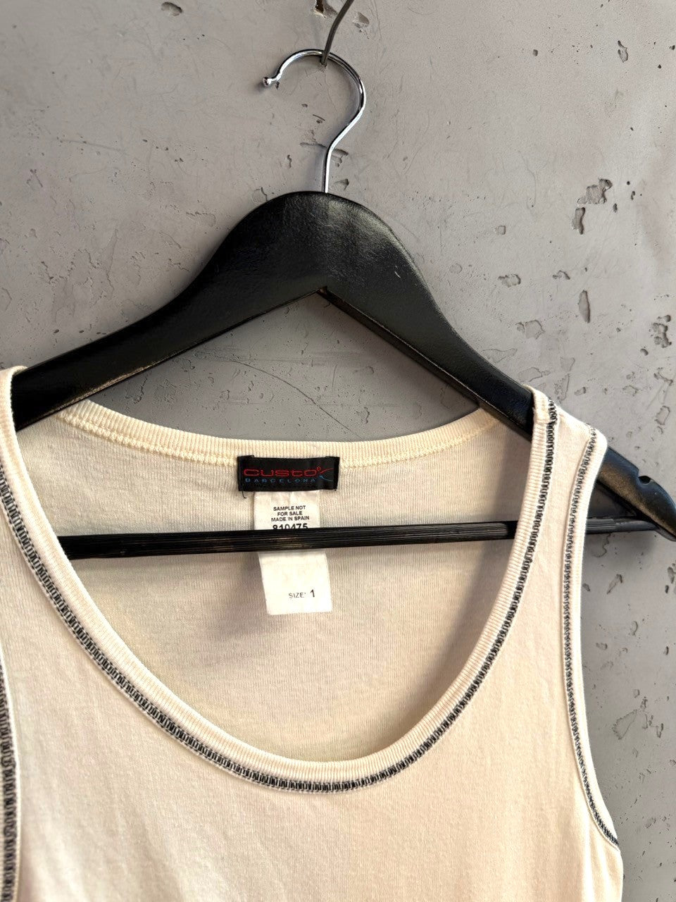 BERLIN VINTAGE CORNER cream Custo Barcelona sleeveless tank top with contrast stitching on a black hanger