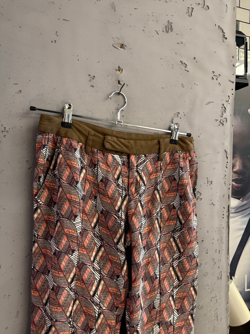 BERLIN VINTAGE CORNER Custo Barcelona trousers featuring a rust, cream, and charcoal leaf print with an olive waistband.