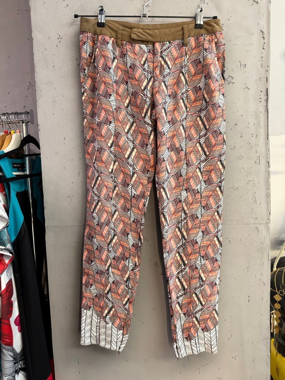 BERLIN VINTAGE CORNER Custo Barcelona trousers featuring an intricate rust, cream, and charcoal leaf print with an olive waistband.