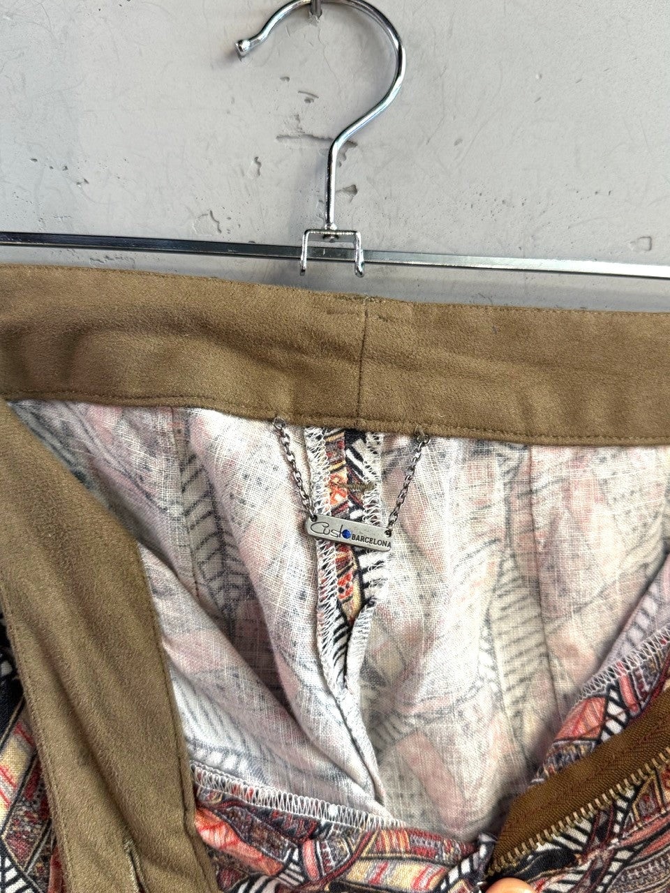 BERLIN VINTAGE CORNER Custo Barcelona trousers featuring a rust, cream, and charcoal leaf print with an olive waistband.